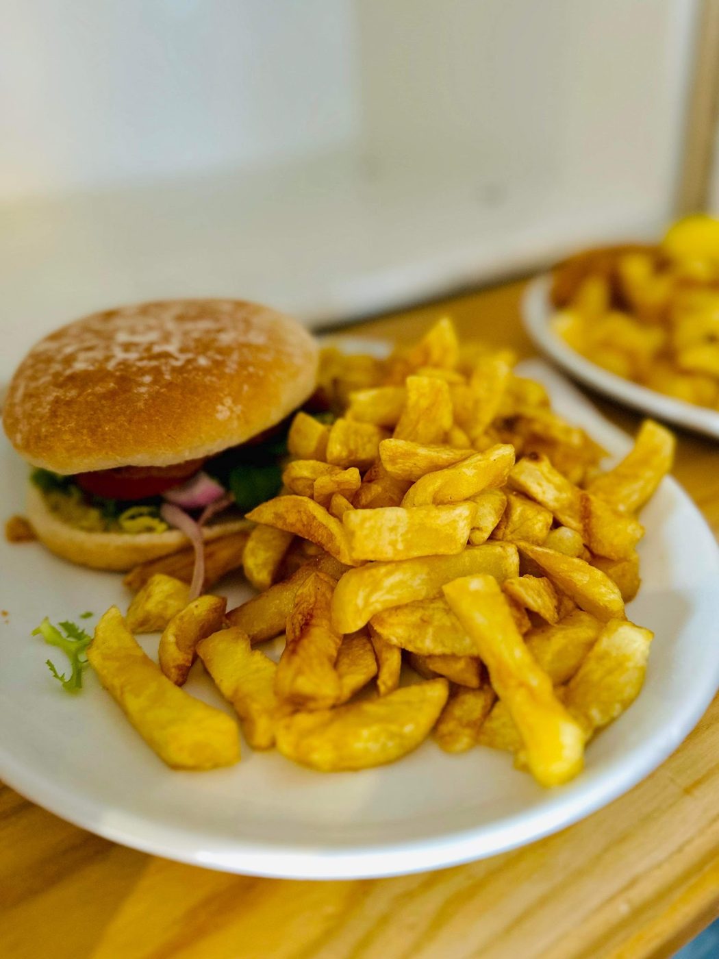 A burger with chunky chips