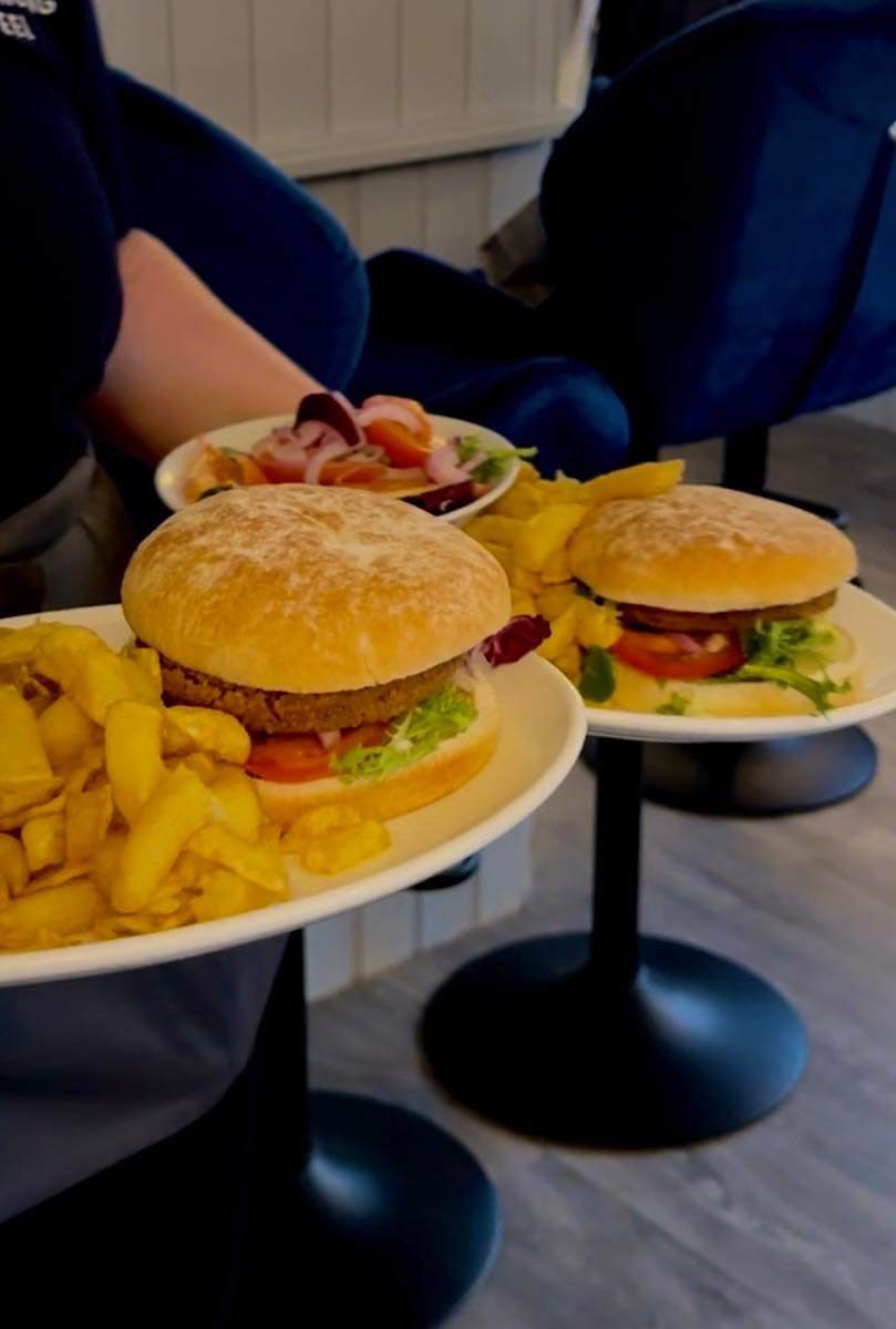 Two burgers with chips