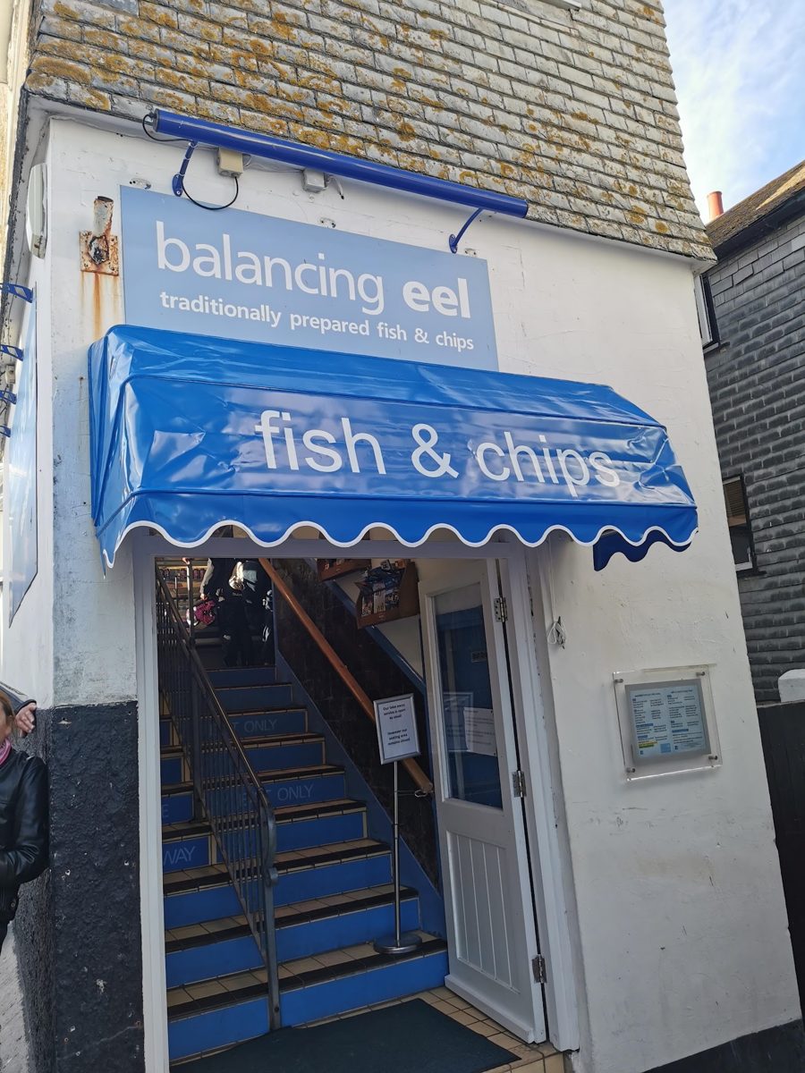 The Balancing Eel entrance with its blue fish & chips awning and stairs